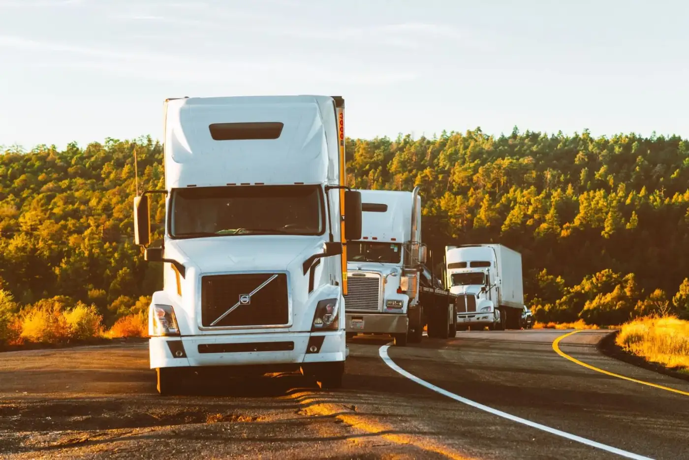 Semi trucks travelling along an open highway