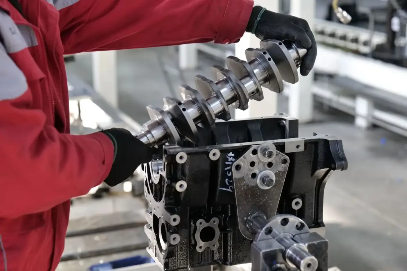 Close-up of a truck engine crankshaft being worked on